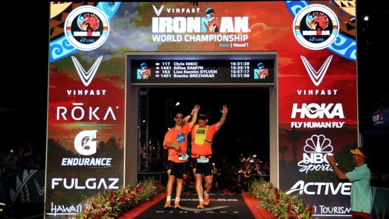 KAILUA KONA, HAWAII - OCTOBER 06: Chris Nikic and guide Dan Grieb celebrate after finishing the Ironman World Championships on October 06, 2022 in Kailua Kona, Hawaii. (Photo by Tom Pennington/Getty Images for IRONMAN)