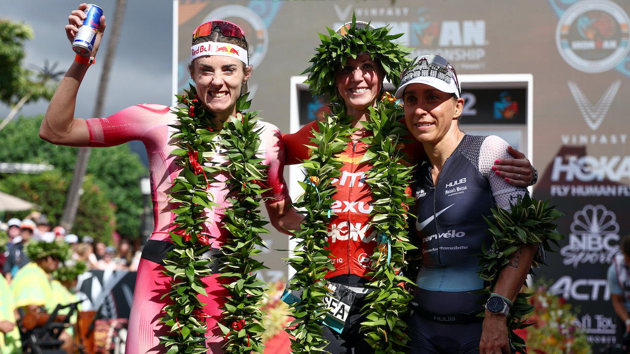 KAILUA KONA, HAWAII - OCTOBER 06: Lucy Charles-Barclay of Great Britain (2nd), Chelsea Sodaro (1st) and Anne Haug of Germany (3rd) celebrate after finishing the Ironman World Championships on October 06, 2022 in Kailua Kona, Hawaii. (Photo by Tom Pennington/Getty Images for IRONMAN)