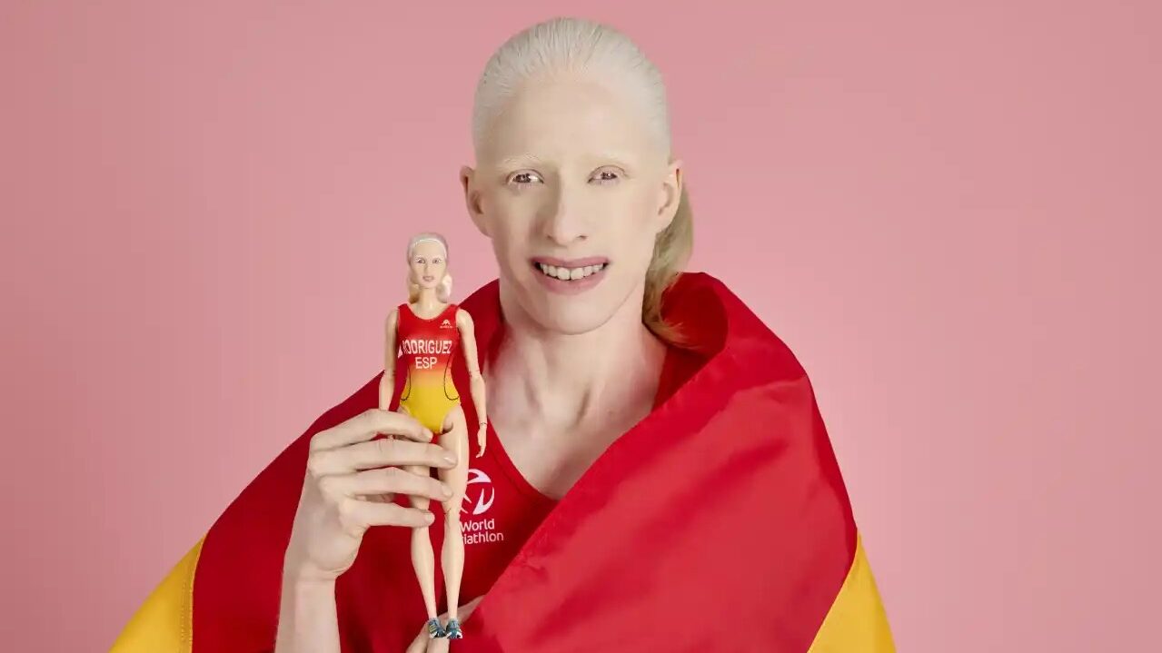 Spanish triathlete Susana Rodriguez with her Barbie doll.